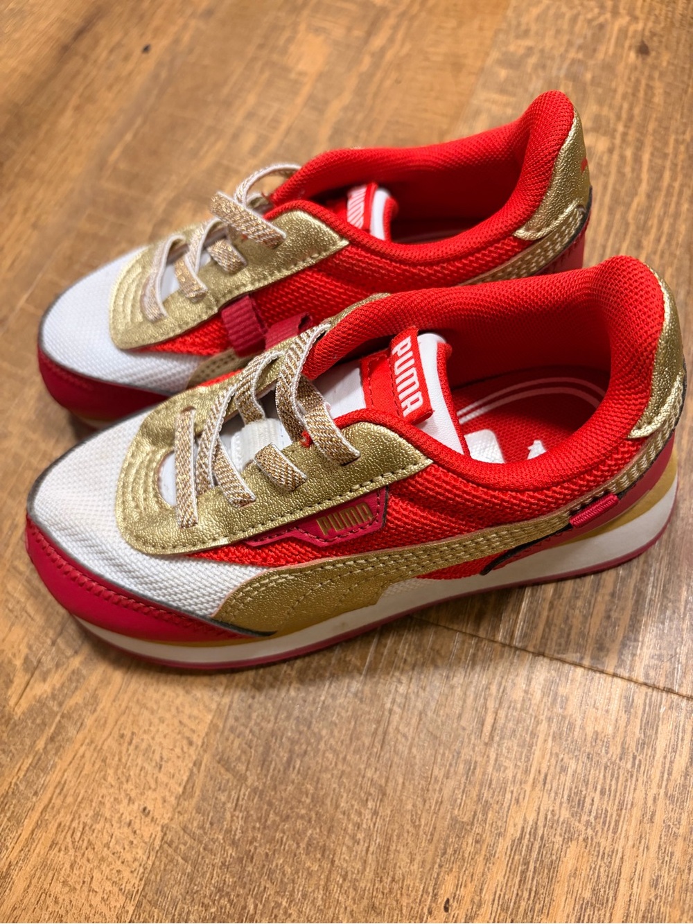 Girls Puma Red and Gold and White Sneakers